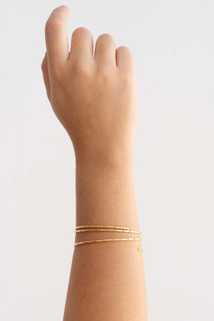 Pulseira Mola Canutilhos Três Voltas Banhado a Ouro 18K
