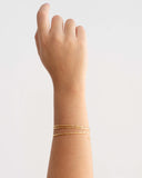 Pulseira Mola Canutilhos Três Voltas Banhado a Ouro 18K