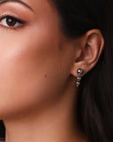 Brinco Palito Curvado Bolas Lisas Ródio Branco