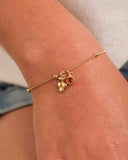 Pulseira Infantil com Bolinhas e Pingentes Uva e Ponto Luz Fucsia Rosa