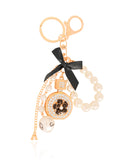 Chaveiro Laço Pérolas Flor Cravejada Cristal Banho Dourado